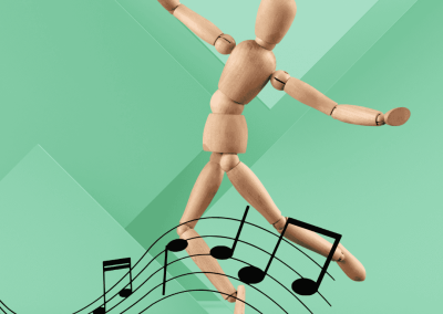 Maniqui de manera articulado en posiciónal de danza, rodeado de notas musicales. Representa la danza y el movimiento como elemento que favorece la diversidad y la inclusión.